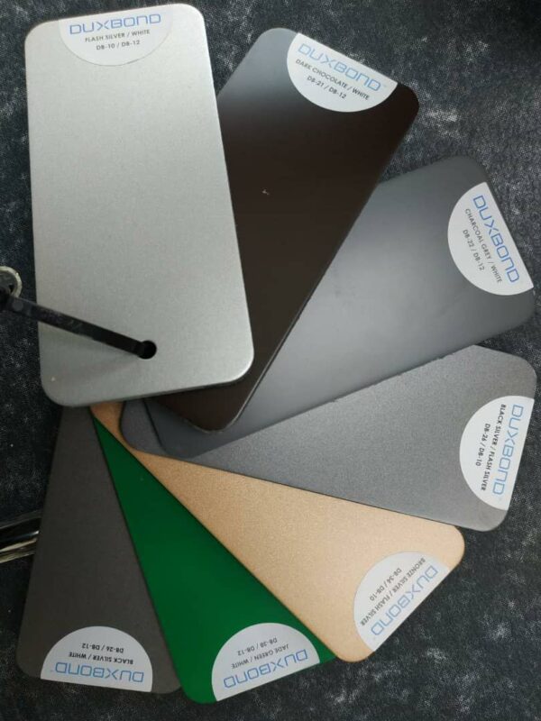 A collection of colorful metal sheets, showcasing various hues suitable for awning roofs and ACP sheet and panels